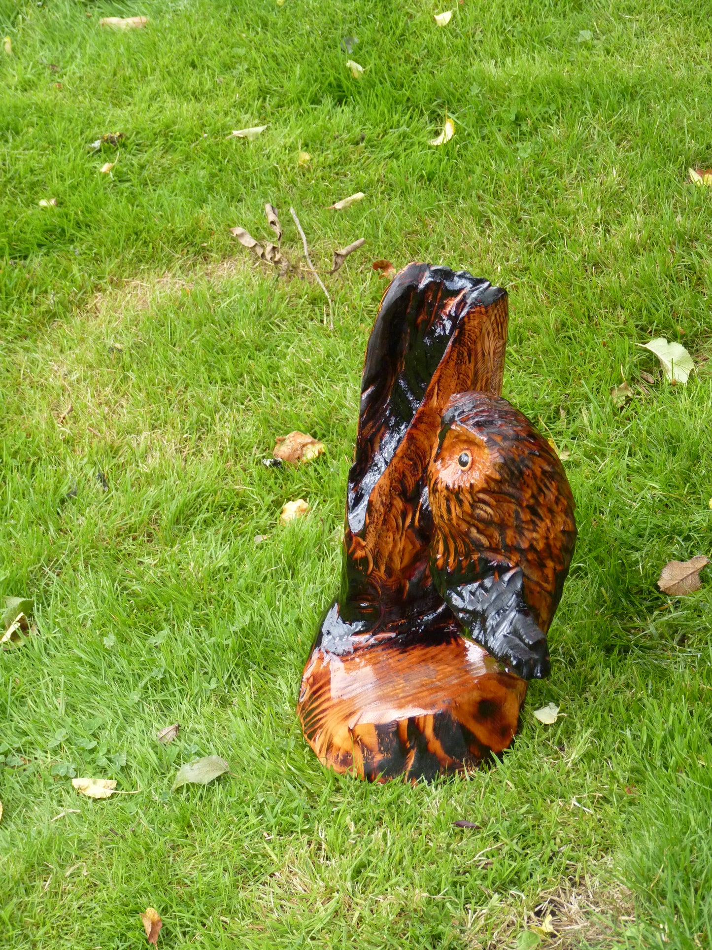 1 chainsaw carved owl on a branch