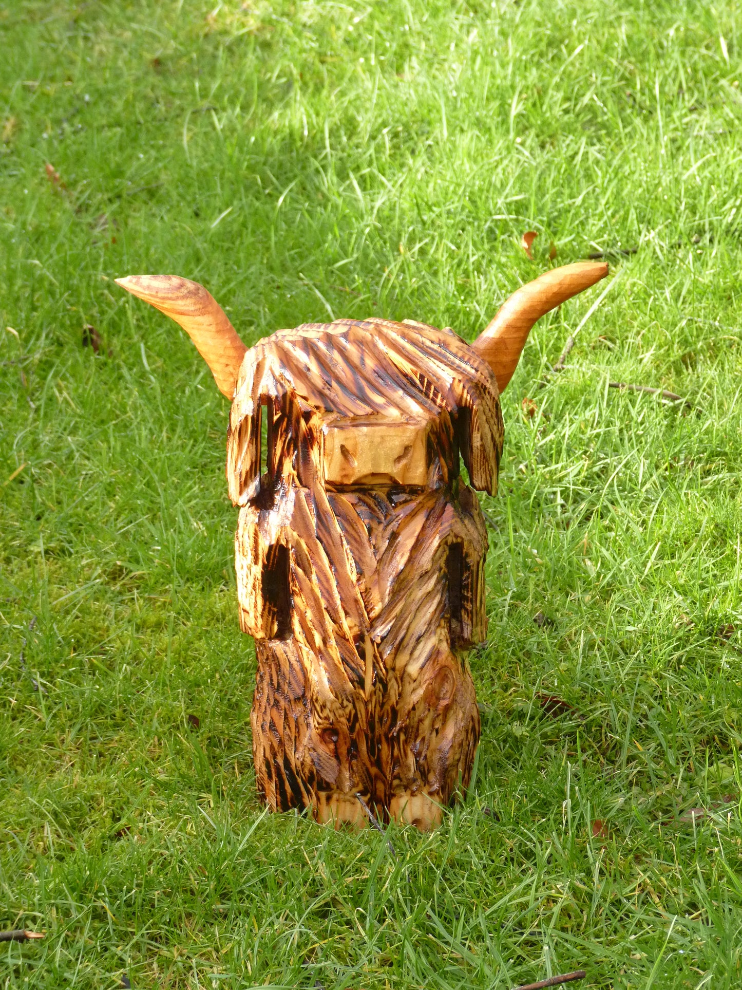 1 Chainsaw carved Highland Cow / Coo sculpture